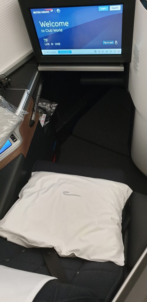 a white pillow on a seat