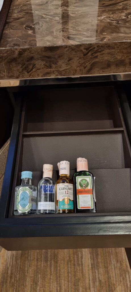a group of bottles in a drawer