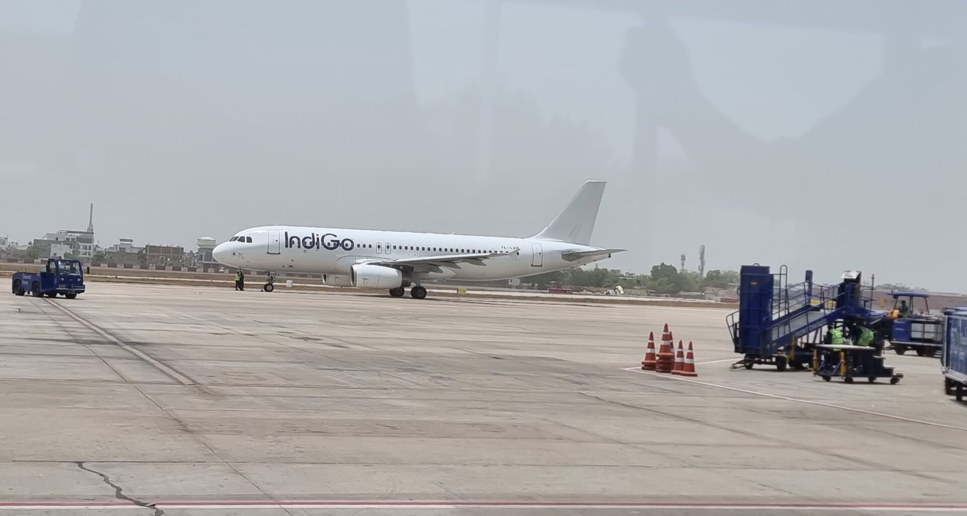 a white airplane on a runway