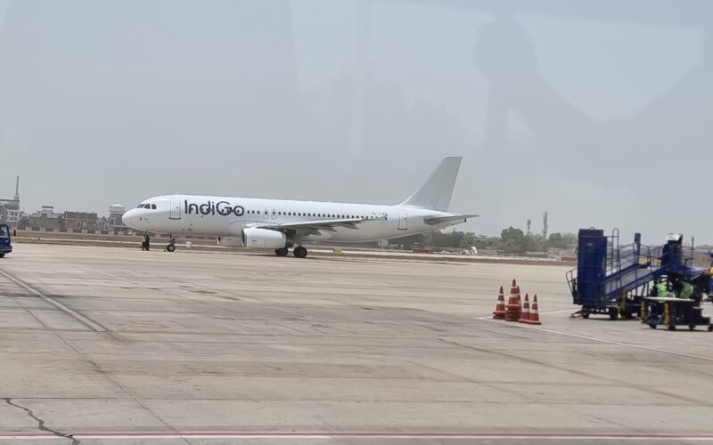 a white airplane on a runway