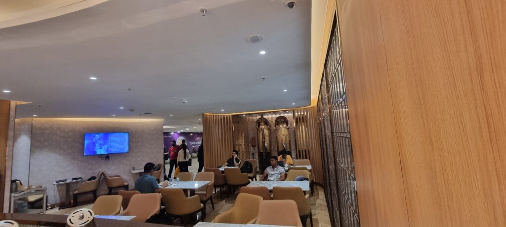 a group of people sitting at tables in a room