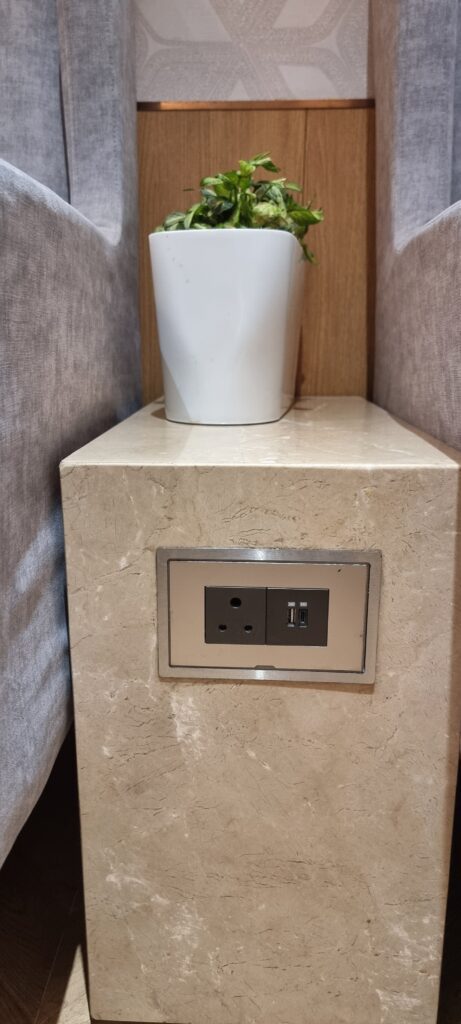 a cup on top of a wall outlet