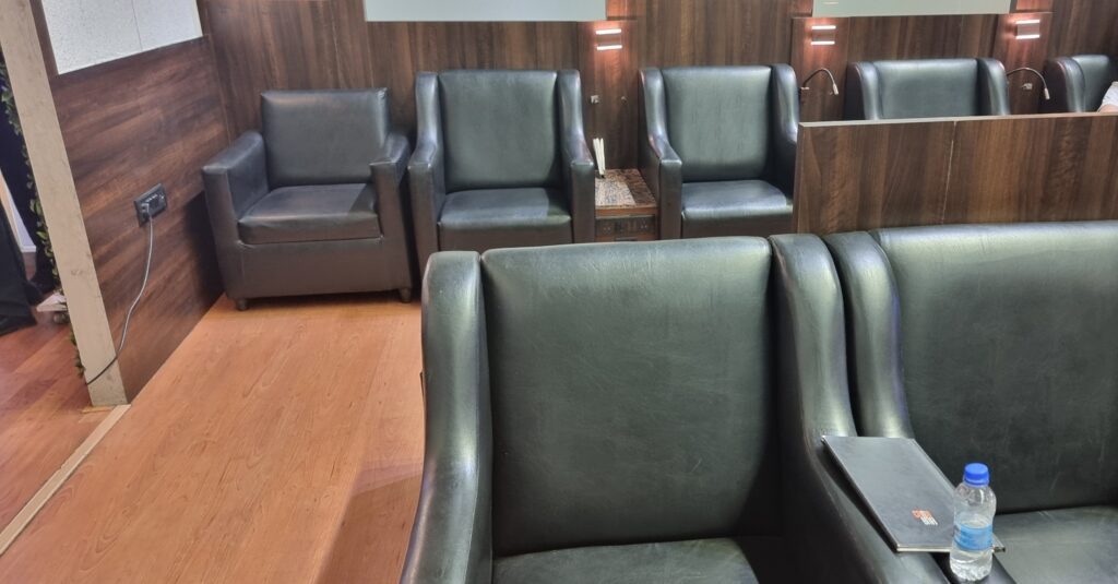 a group of chairs in a room Primus lounge Amritsar