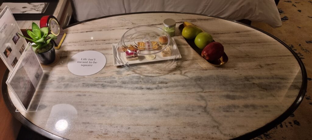 a plate of food and fruit on a table Shangri-la