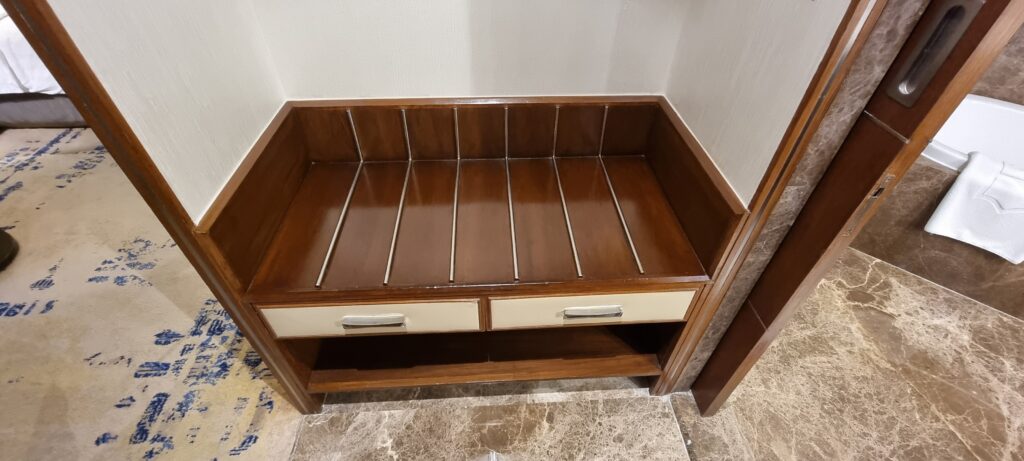 a wooden shelf with drawers