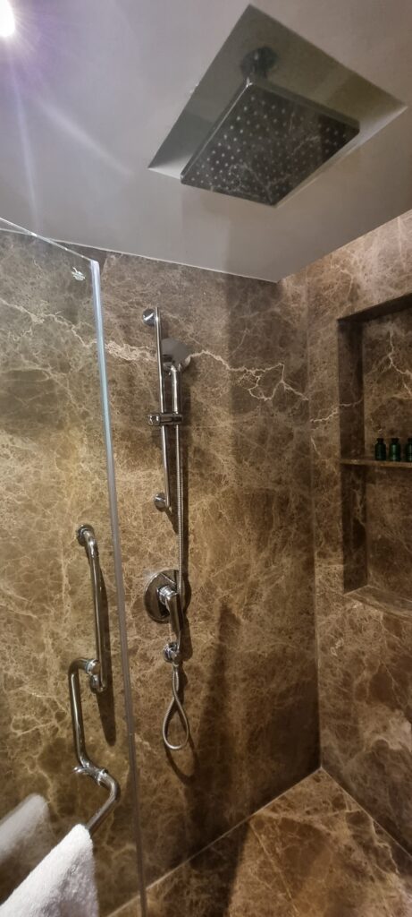 a shower with a shower head Shangri-la