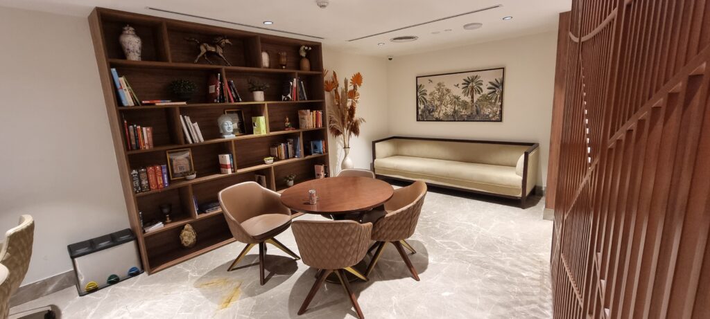 a room with a table and chairs Encalm Privé lounge Delhi working space