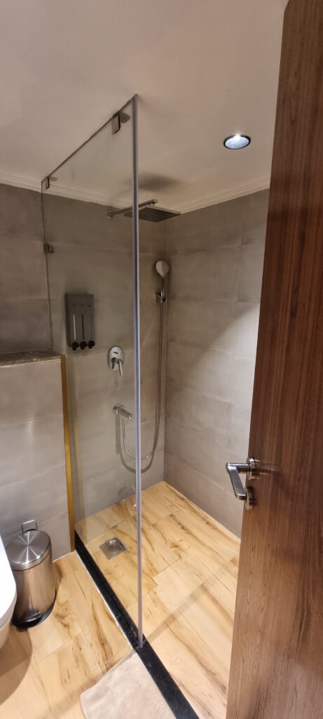 a shower with a stand up shower