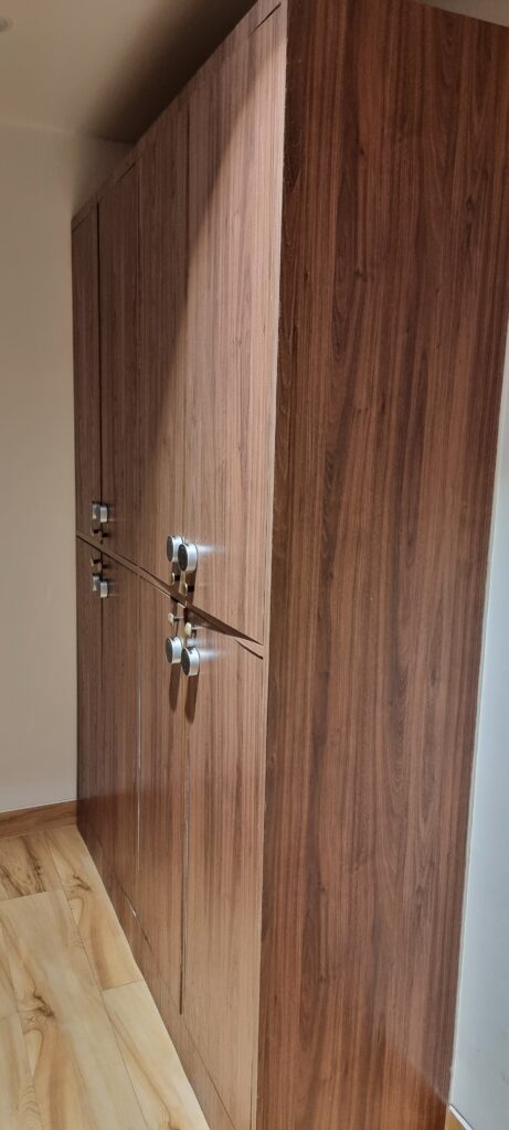 a wooden cabinet with silver knobs gym lockers Encalm prive lounge