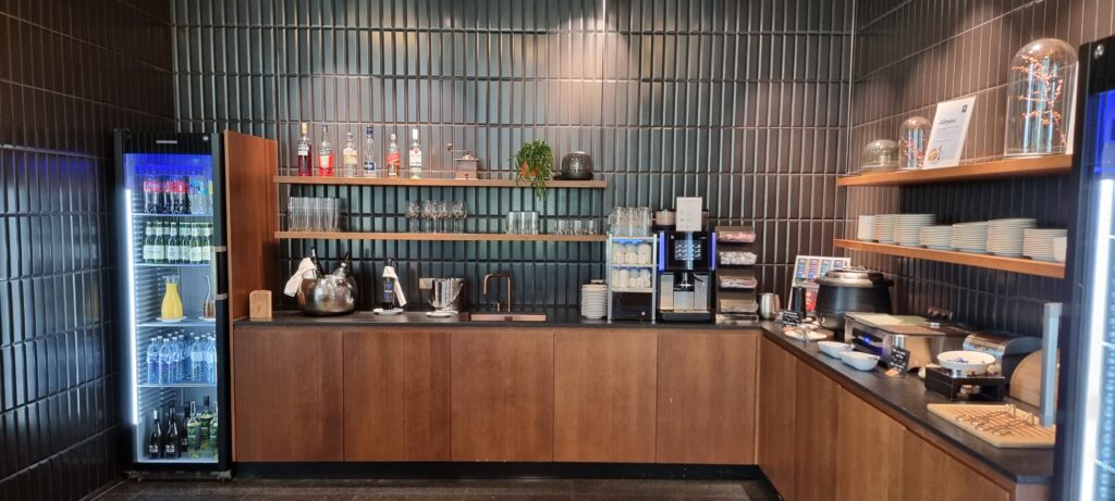 a coffee bar with shelves and glasses