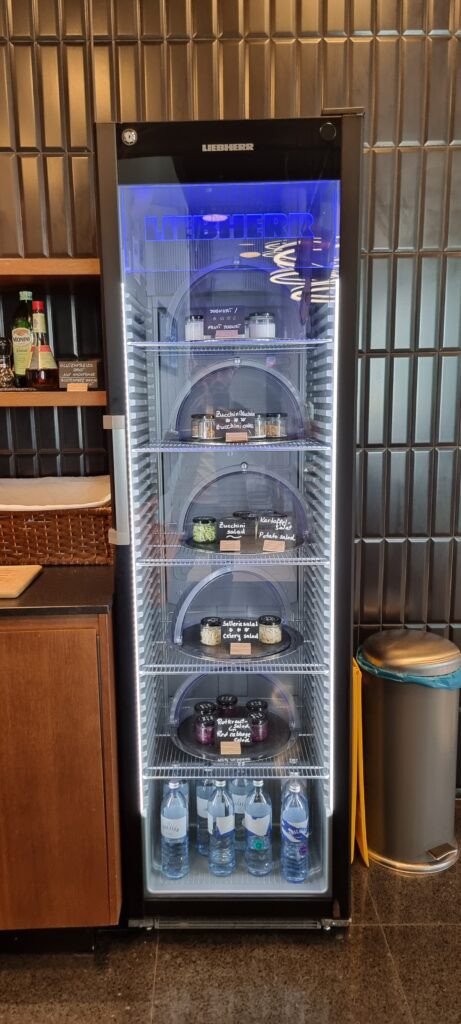 a refrigerator with food on shelves Tyrol lounge salad fridge.