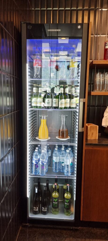 a refrigerator full of bottles and liquid Tyrol lounge