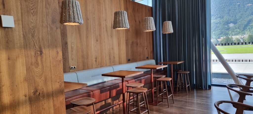 a table and stools in a room