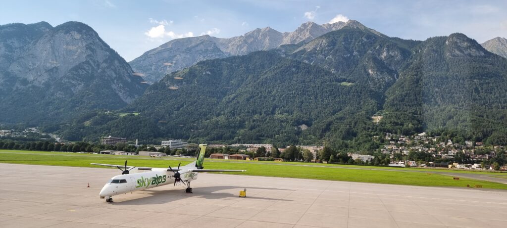 a plane on the runway Tyrol lounge views.