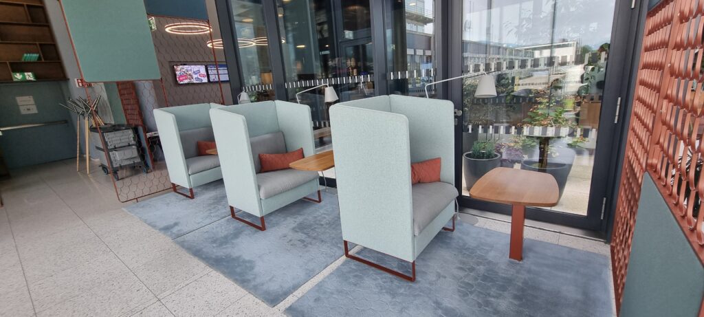 a group of chairs and tables in a room