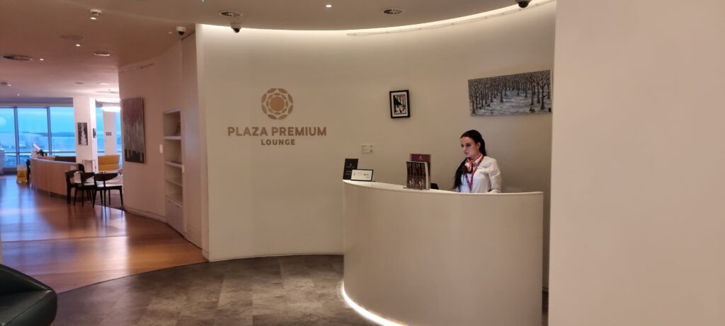 a woman standing at a reception desk