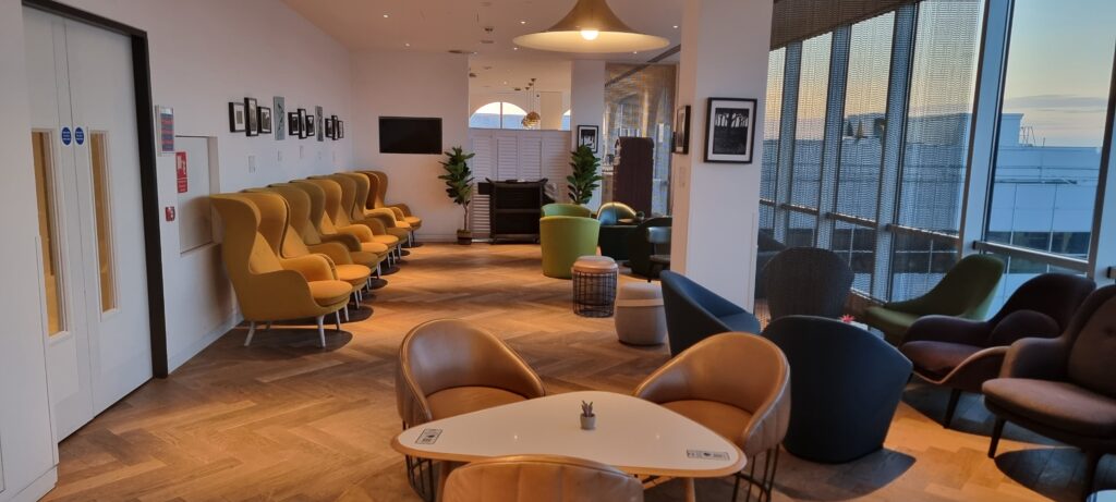 a room with chairs and tables Review Plaza Premium Gatwick