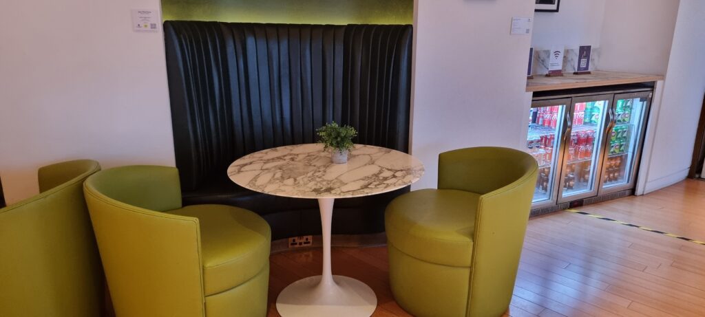 a table with a plant on it Review Plaza Premium Gatwick