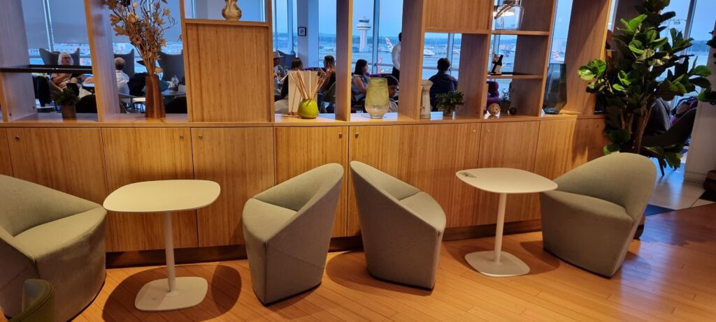 a room with chairs and tables Plaza Premium Lounge Review Plaza Premium Gatwick