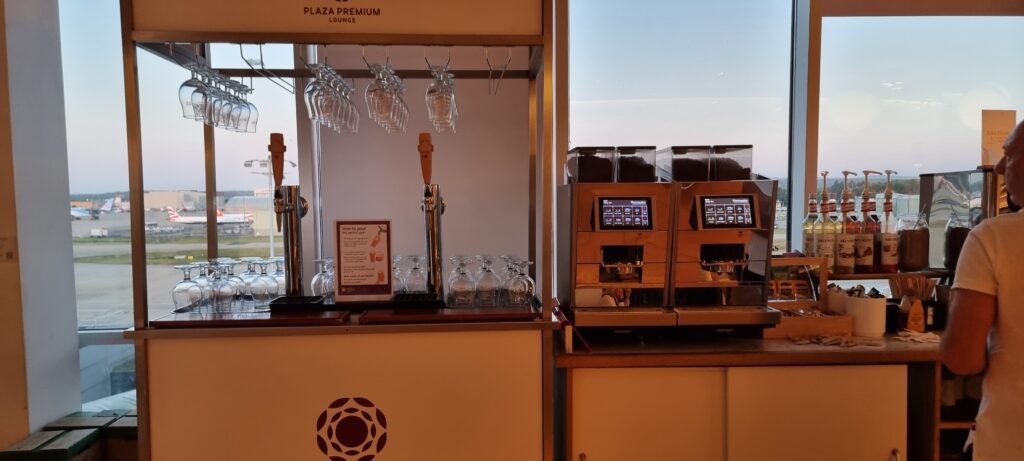 a coffee machine and glasses on a counter