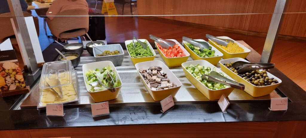 a row of bowls of food