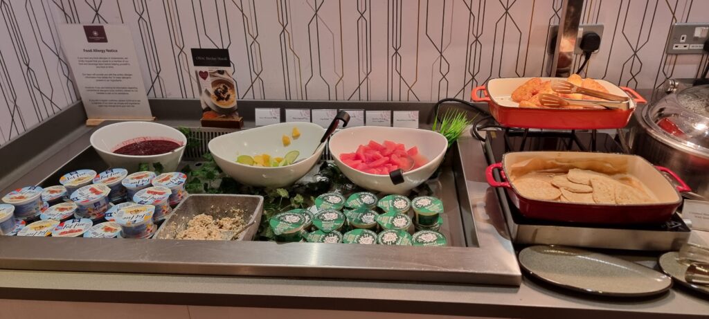 a buffet table with bowls of food