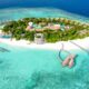 an island with a pool and a building on it