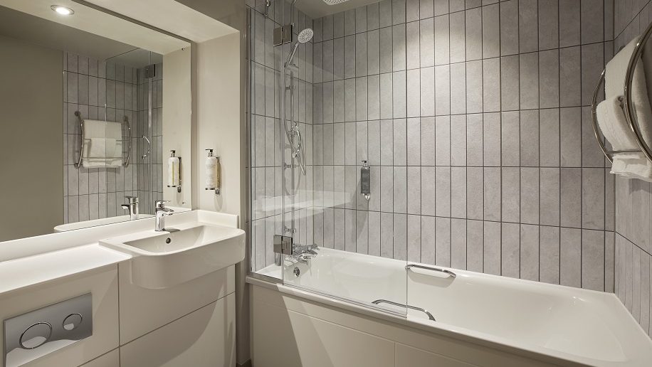 a bathroom with a bathtub and sink