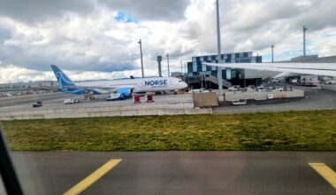 an airplane parked on a runway Norse Atlantic B789