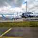 an airplane parked on a runway Norse Atlantic B789