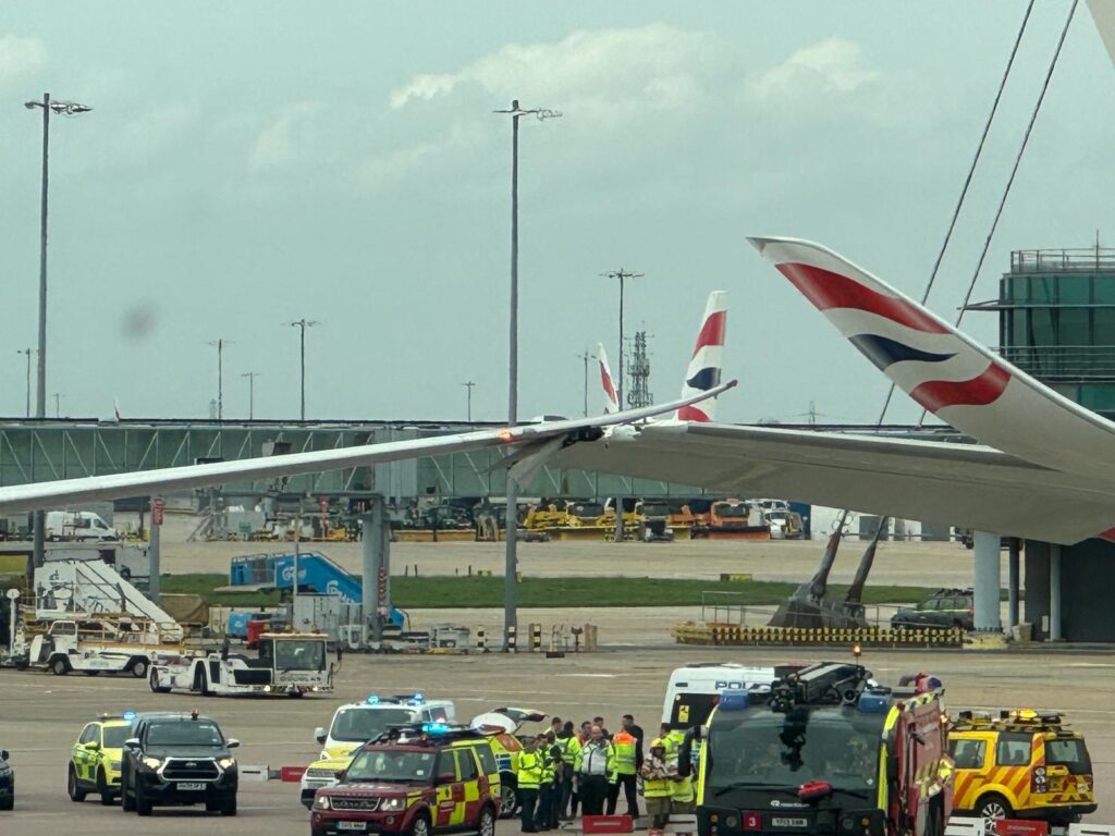 a group of people around an airplane airbus 