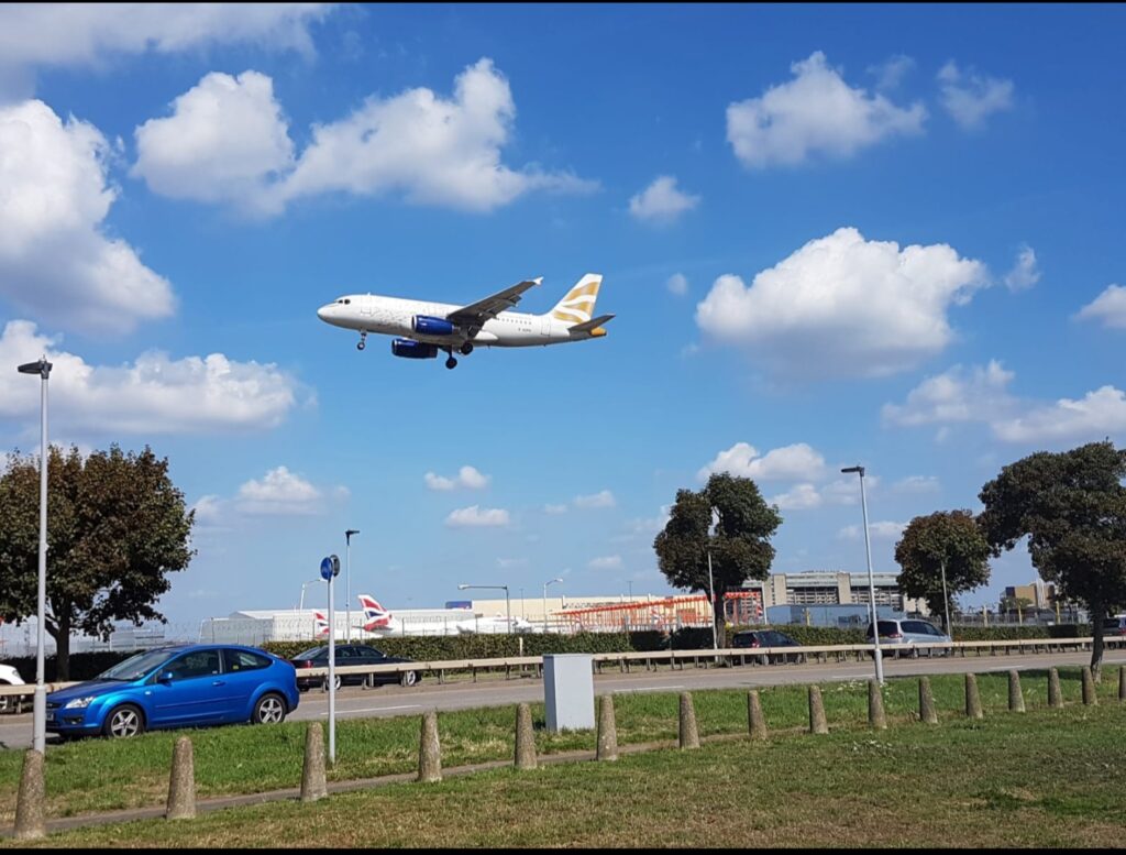 a plane flying over a runway