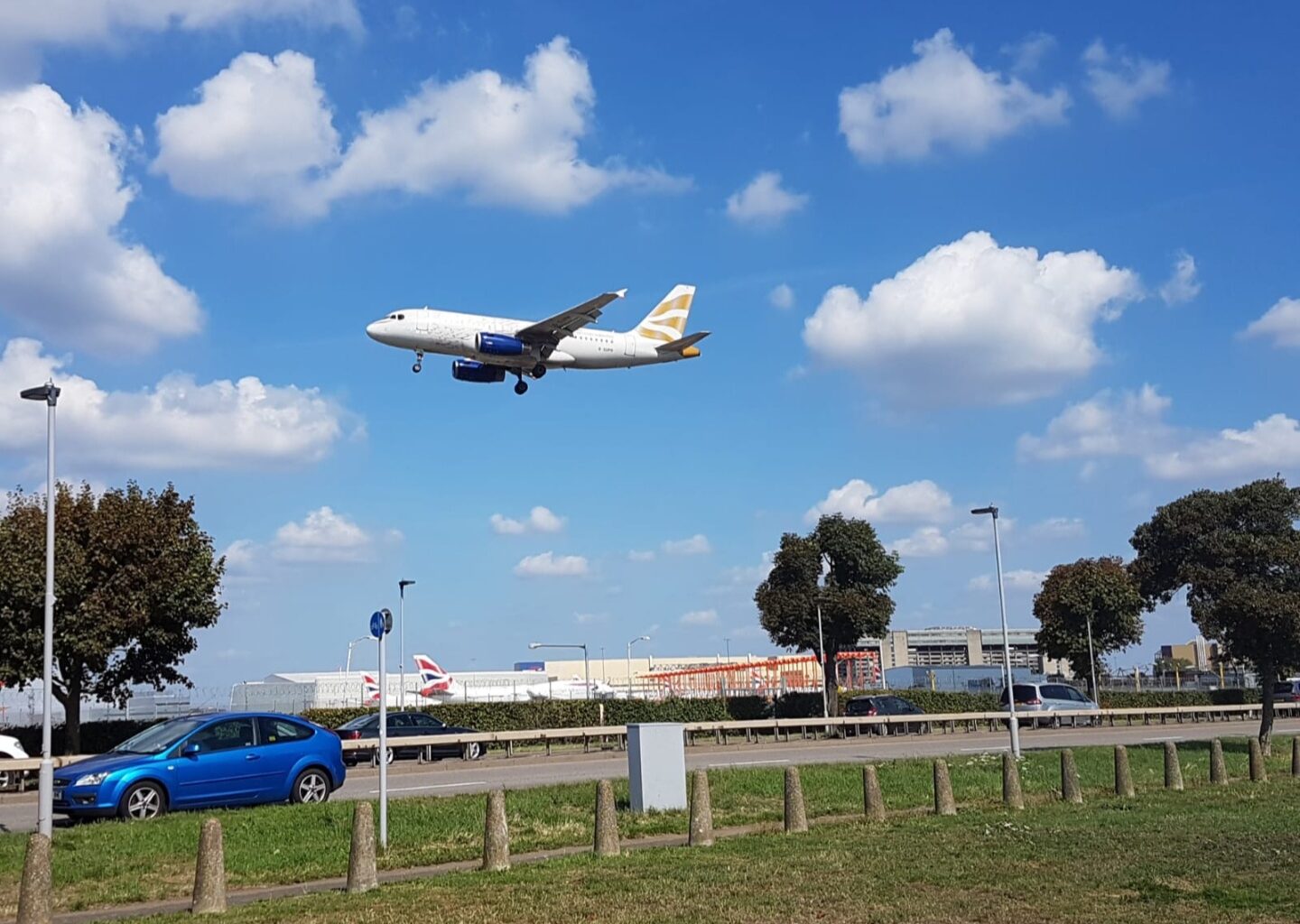 a plane flying over a runway