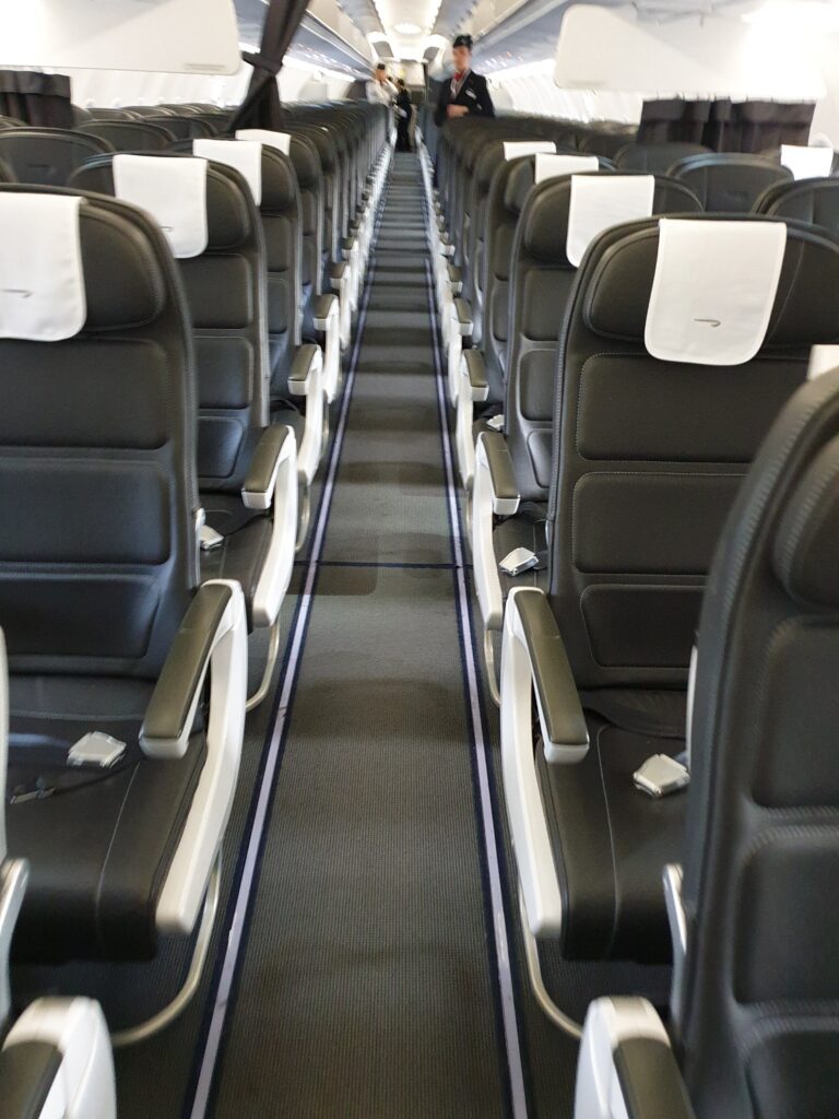 a row of seats in a plane British Airways