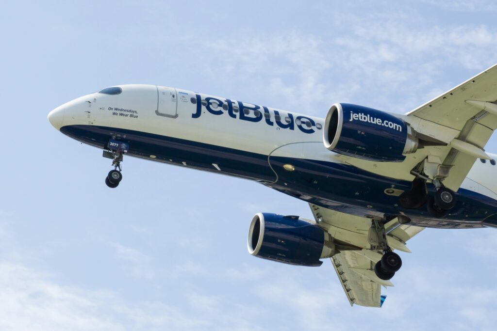 a jet plane in the sky JetBlue