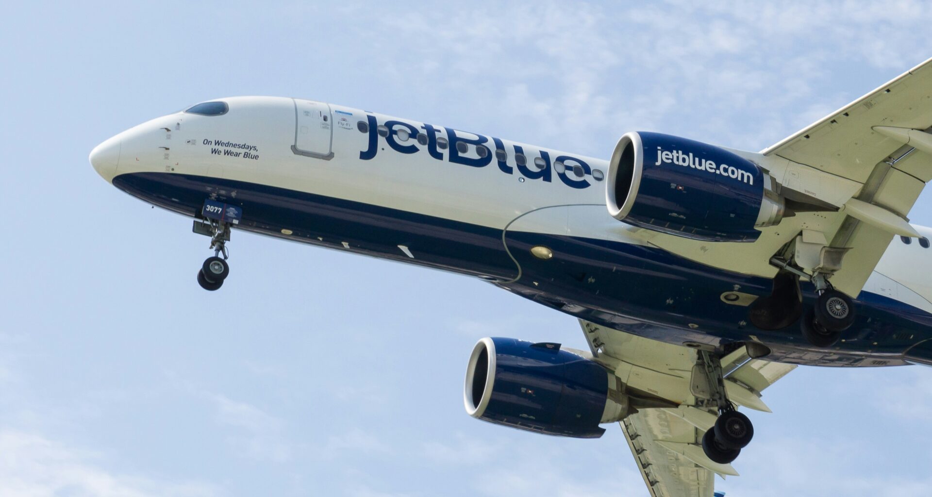 a jet plane in the sky JetBlue