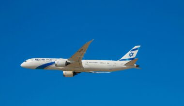 a white airplane in the sky ElAl flights