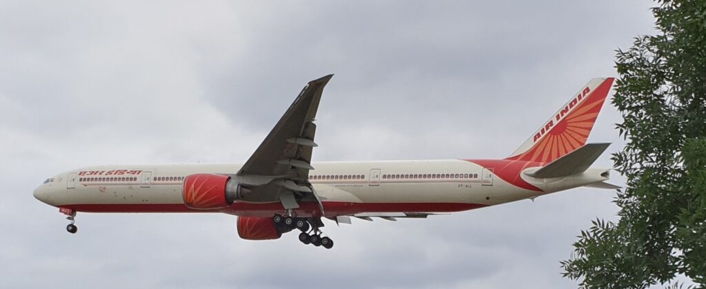 a plane flying in the sky Air India