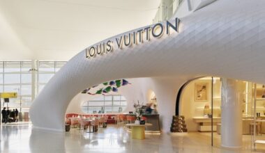 a restaurant with tables and chairs Louis Vuitton