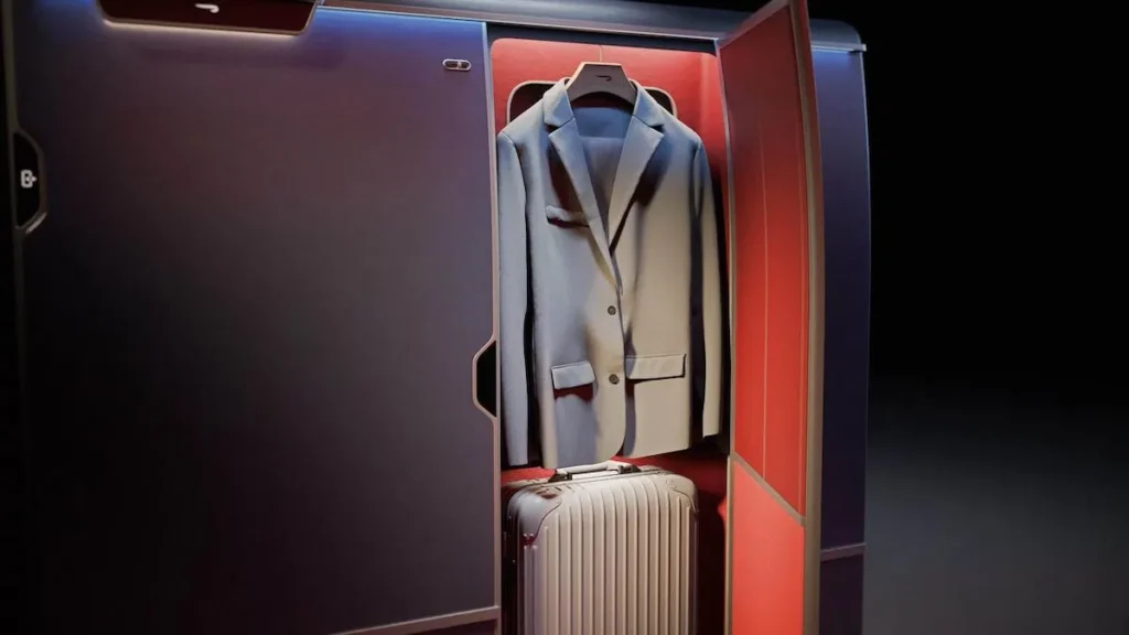 a suit jacket and luggage in a closet British Airways first class