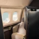 an airplane with a seat and windows British Airways first class suite