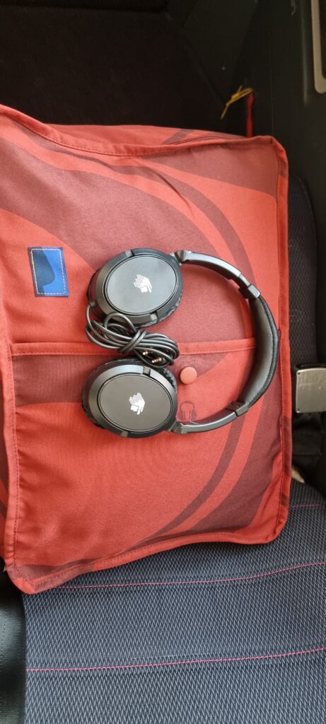 a pair of headphones on a pillow Aeromexico business class