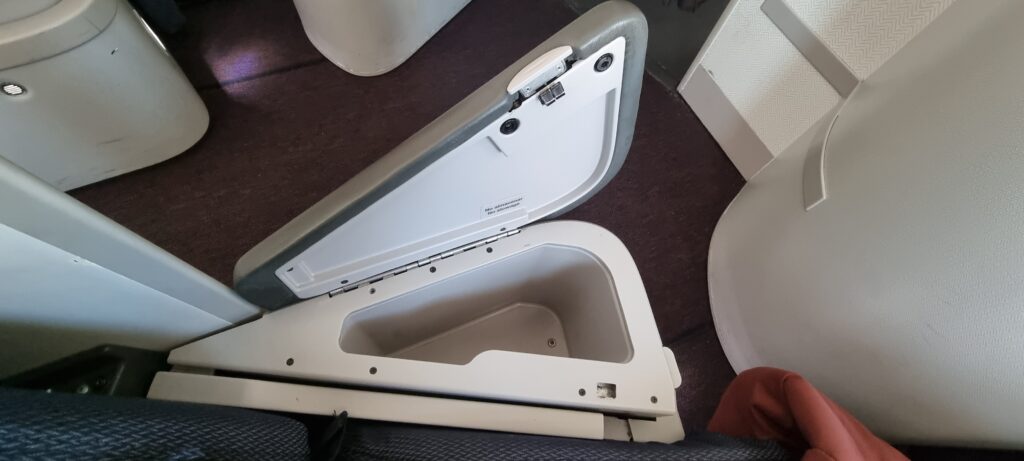 a white and grey toilet seat Aeromexico business class