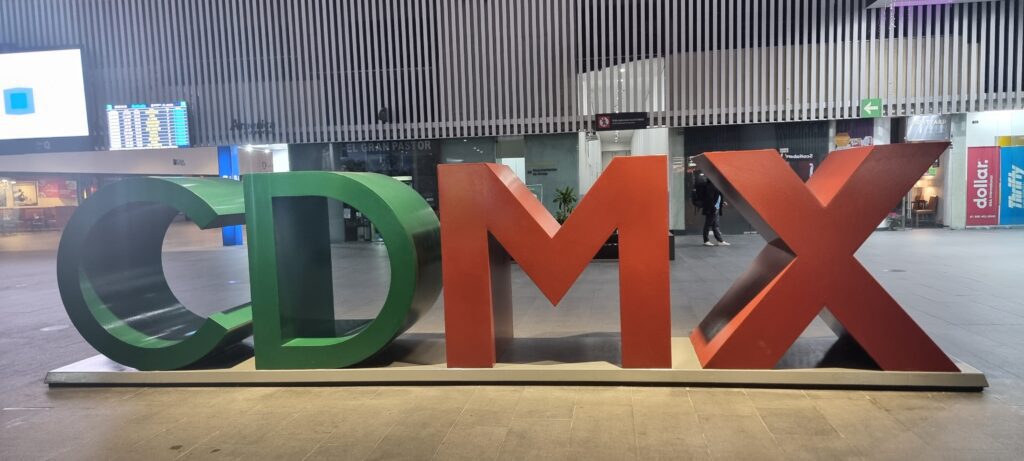 a large red and green letters Aeromexico business class