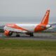 an airplane on a runway easyJet Heathrow