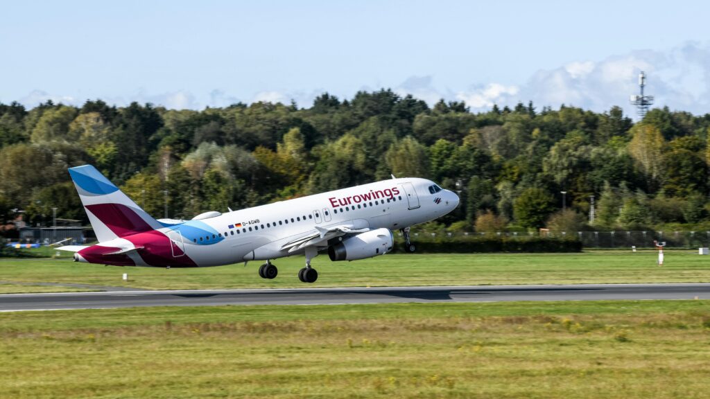 a plane taking off from a runway Boeing 737