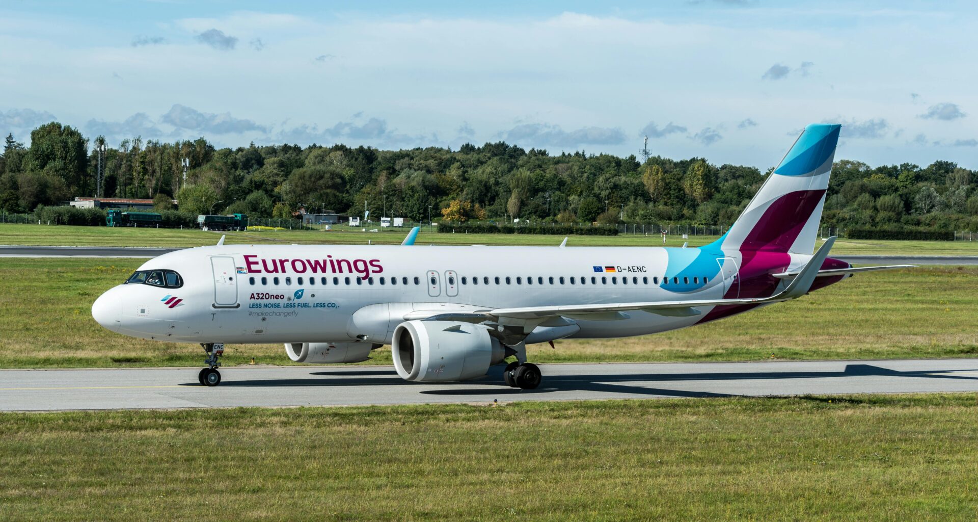 a white airplane on a runway boeing 737 eurowings