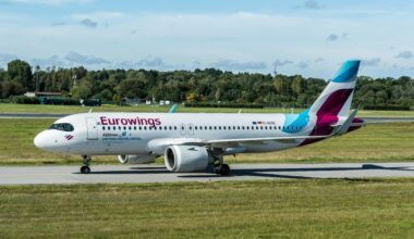 a white airplane on a runway boeing 737 eurowings