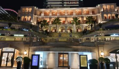 a building with many balconies and stairs China visa