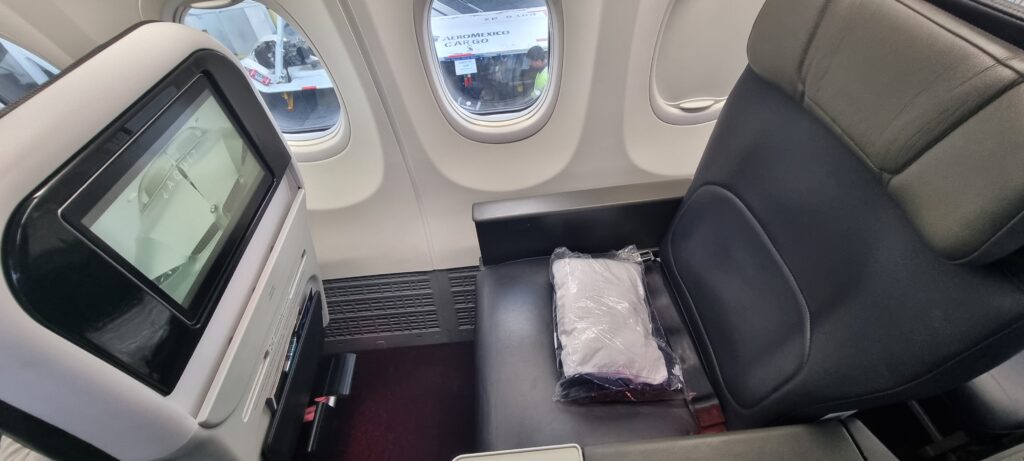 a seat in an airplane Aeromexico business class